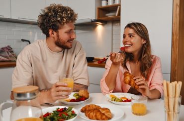 A young couple enjoying a healthy meal together at home